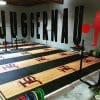 Wall signage displayed at a fitness event with customized gym branding