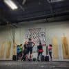 Custom 13 oz vinyl banner displaying gym branding and messaging