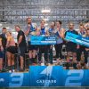 Custom competition podium wrap with vibrant event branding