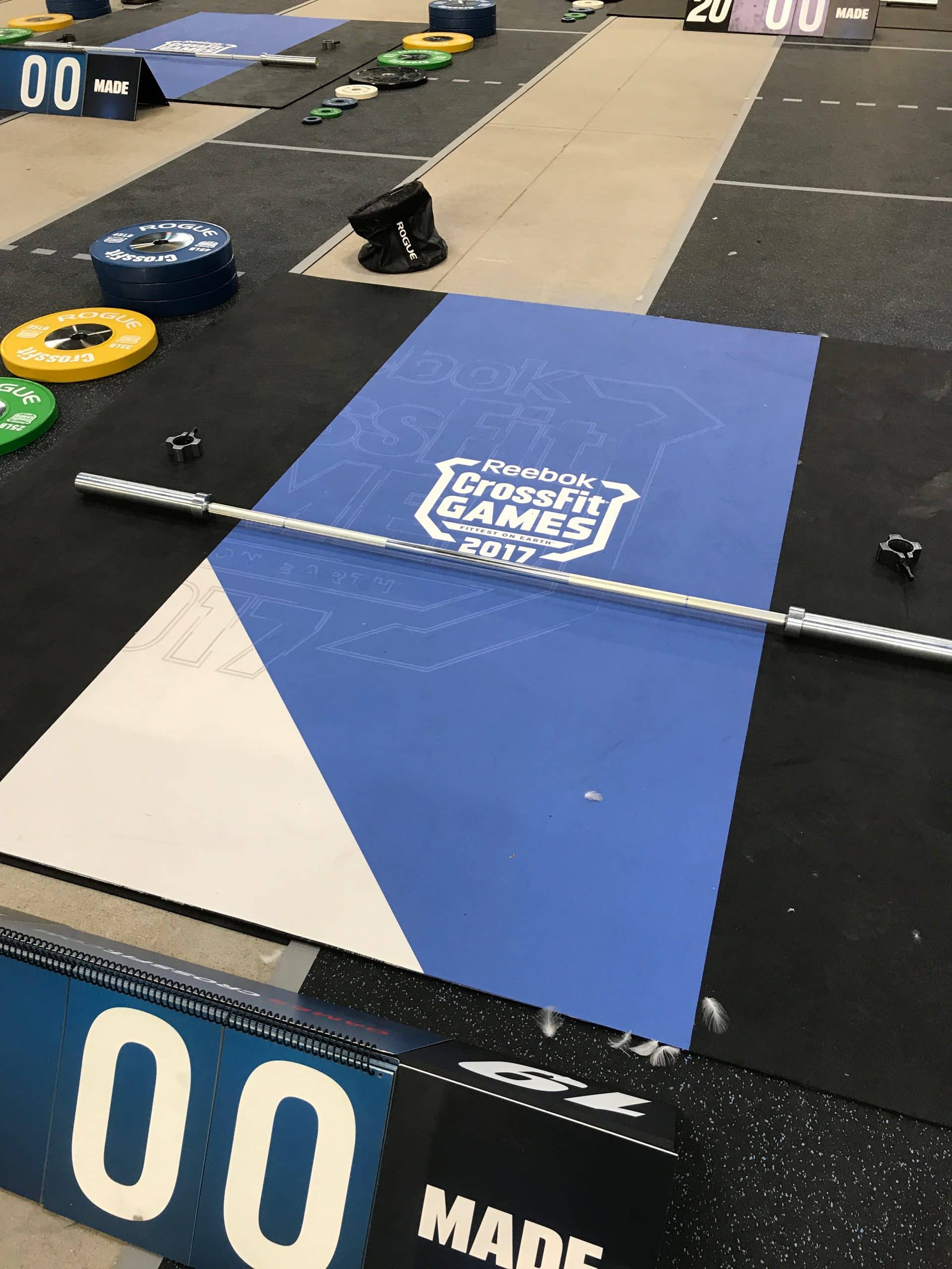 Full-scale gym event photo showing signage on wall and flooring