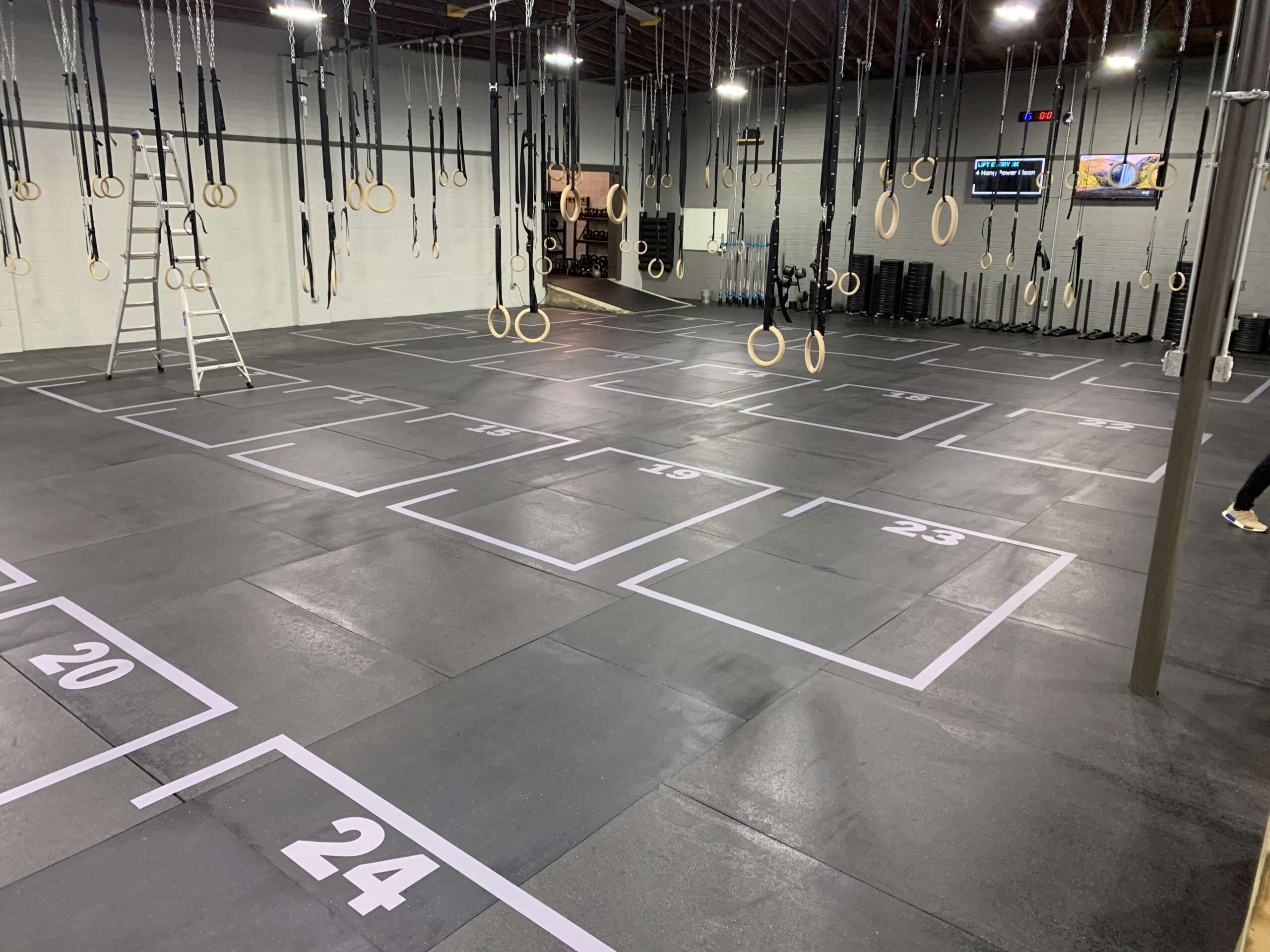 Floor grid decals for gyms, durable vinyl for safety, spacing, and heavy equipment use.