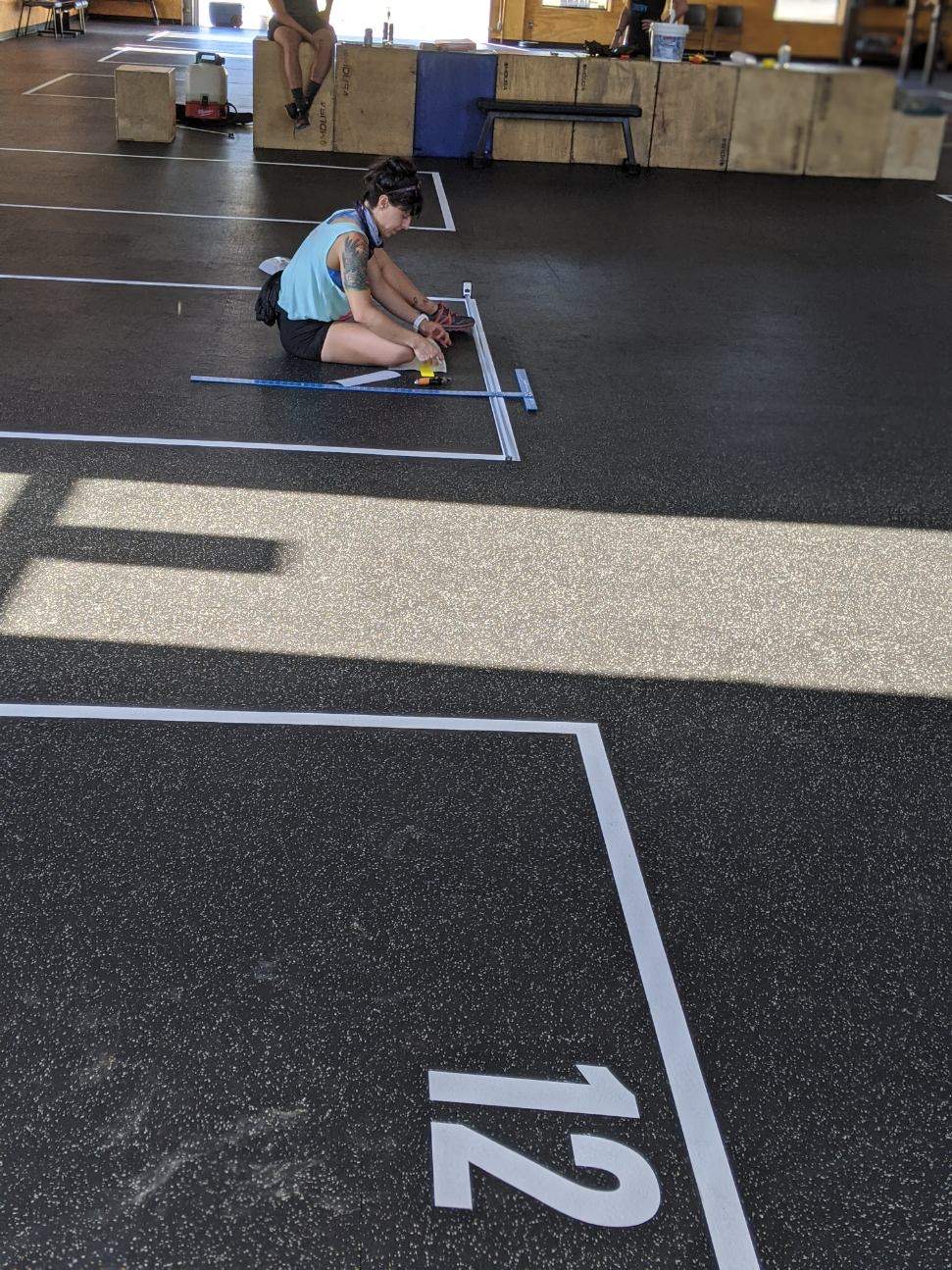 Floor grid decals for gyms, durable vinyl for safety, spacing, and heavy equipment use.