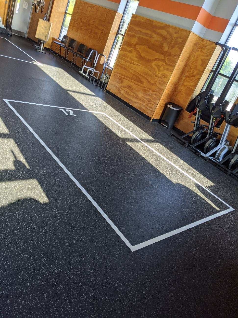 Floor grid decals for gyms, durable vinyl for safety, spacing, and heavy equipment use.