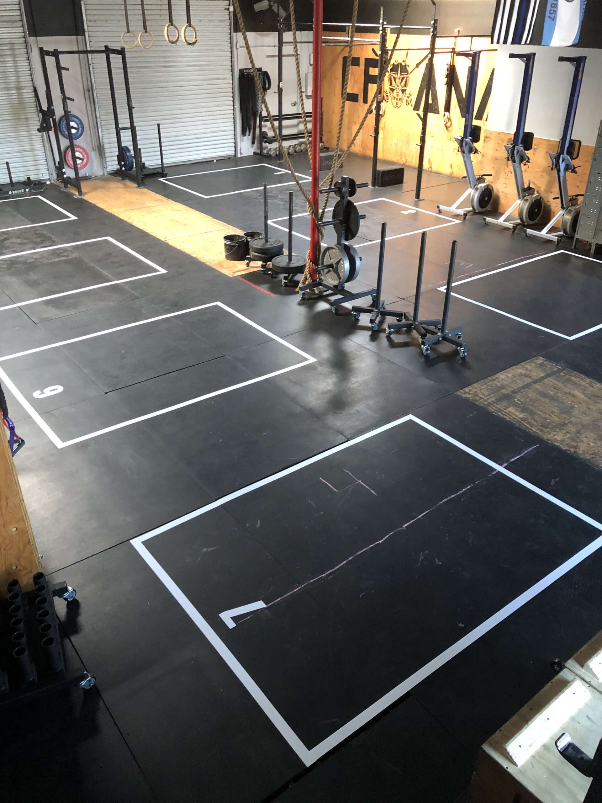 Floor grid decals for gyms, durable vinyl for safety, spacing, and heavy equipment use.