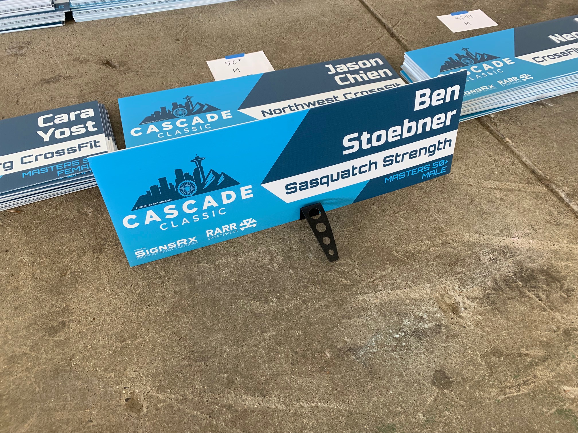 Custom printed athlete name signs for podium display