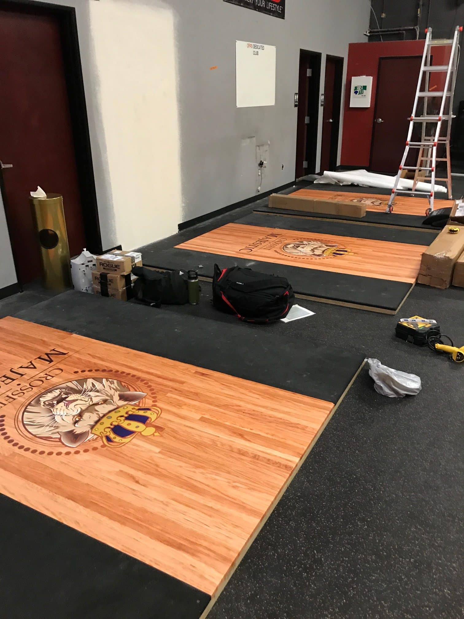 Rotated view of custom signage display at a gym competition event