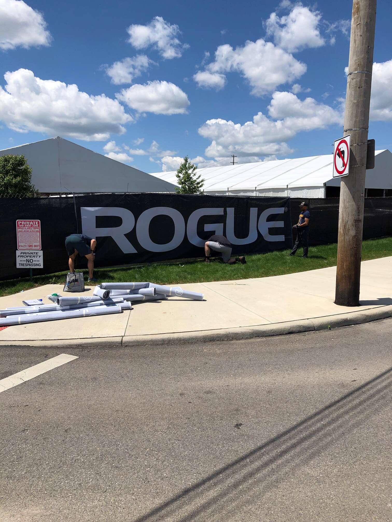 CrossFit competition mesh banner on metal fencing
