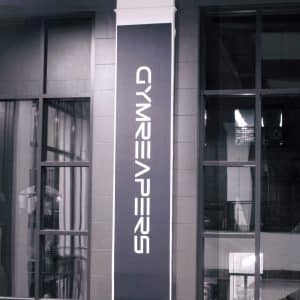 Repositionable adhesive fabric for smooth wall and glass application
